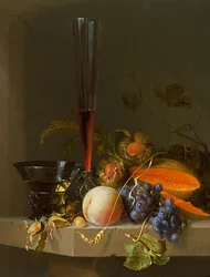 Nature morte de fruits sur une corniche avec un roemer et un verre à vin